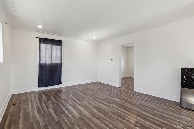 4401 W Mississippi Ave, Denver, CO 80219 - spare room with wood finished floors, baseboards, and recessed lighting