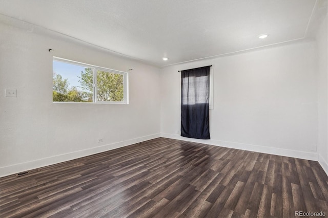 4401 W Mississippi Ave, Denver, CO 80219 - spare room with baseboards, dark wood-style flooring, and recessed lighting