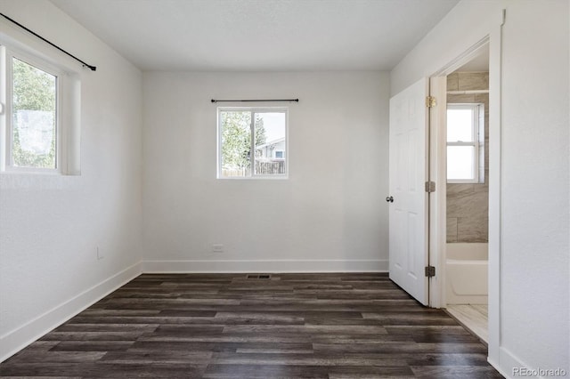 4401 W Mississippi Ave, Denver, CO 80219 - empty room with baseboards and dark wood-style flooring