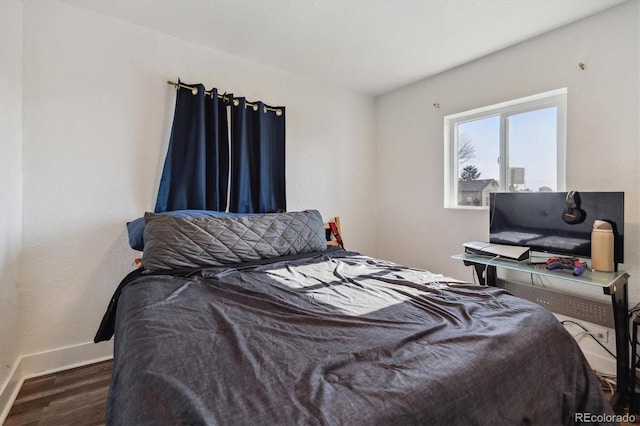 4401 W Mississippi Ave, Denver, CO 80219 - bedroom featuring wood finished floors and baseboards