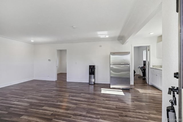 4401 W Mississippi Ave, Denver, CO 80219 - unfurnished living room with dark wood-style floors, recessed lighting, and baseboards