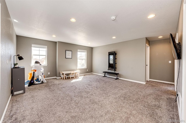 recreation room featuring carpet floors, baseboards, and recessed lighting