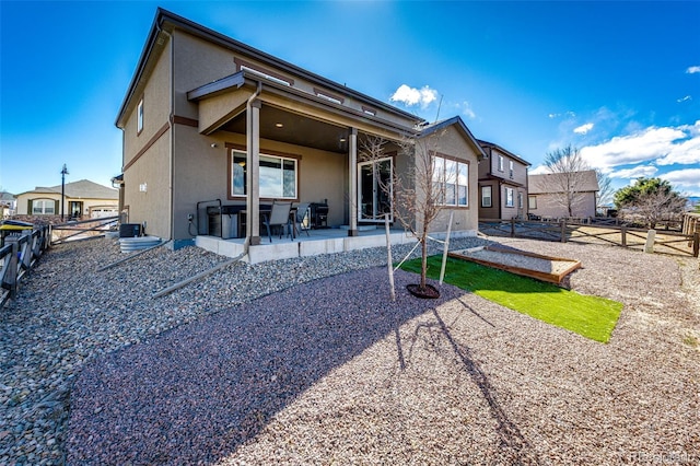 back of property featuring a patio area, a fenced backyard, and stucco siding