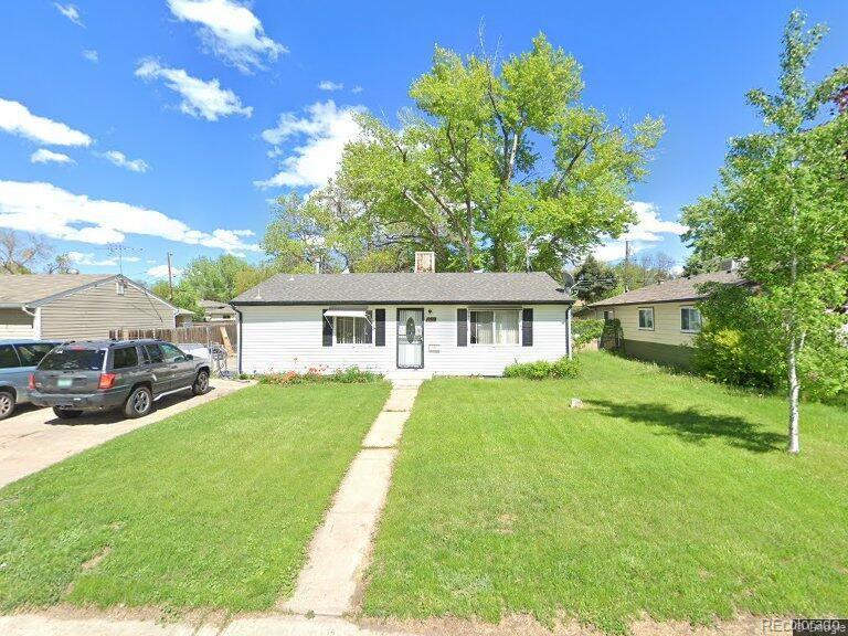 3920 S Inca St, Englewood, CO 80110 - view of front of house with a front yard, a chimney, and driveway