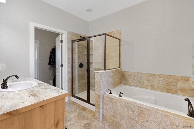 bathroom featuring vanity and plus walk in shower