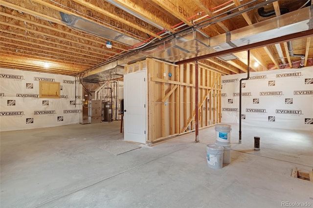 basement with heating unit and water heater