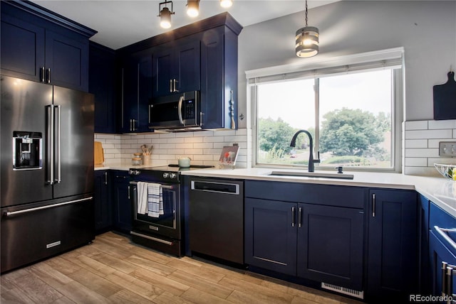 5555 E Briarwood Ave Unit 603, Centennial, CO 80122 - kitchen featuring high end fridge, stainless steel microwave, dishwasher, electric range, and blue cabinetry