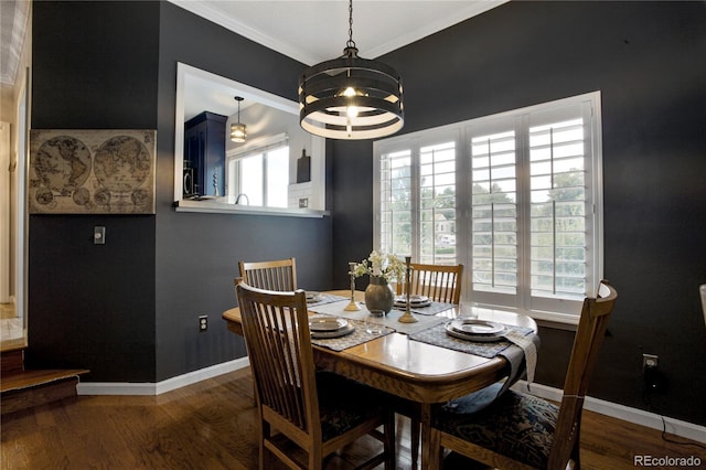 5555 E Briarwood Ave Unit 603, Centennial, CO 80122 - dining space with wood finished floors, a chandelier, and ornamental molding