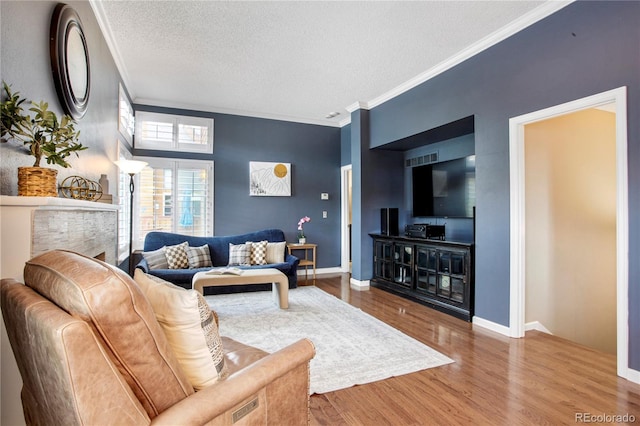 5555 E Briarwood Ave Unit 603, Centennial, CO 80122 - living room with a textured ceiling, ornamental molding, and wood finished floors