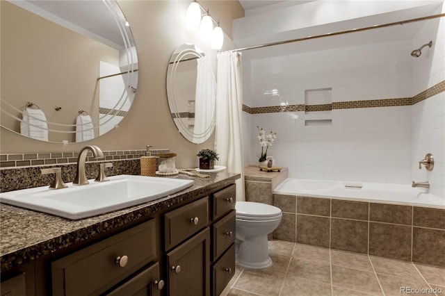 5555 E Briarwood Ave Unit 603, Centennial, CO 80122 - bathroom with tiled shower / bath combo, vanity, and tile patterned floors