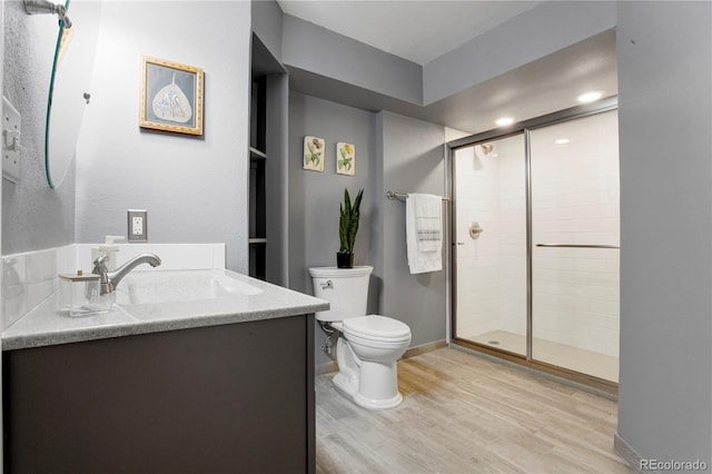 5555 E Briarwood Ave Unit 603, Centennial, CO 80122 - full bathroom with vanity, a shower stall, and wood finished floors