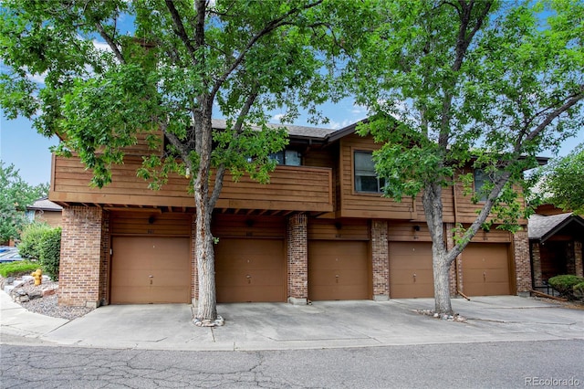 5555 E Briarwood Ave Unit 603, Centennial, CO 80122 - multi unit property with a garage, brick siding, and concrete driveway