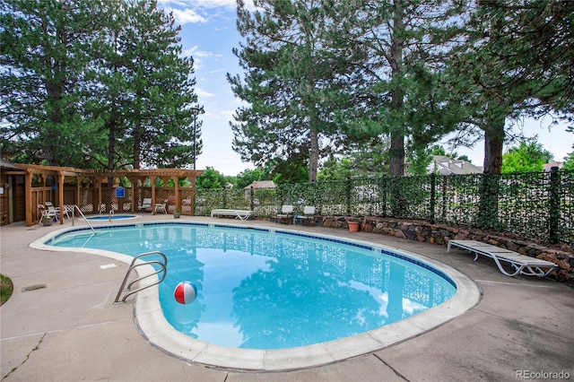 5555 E Briarwood Ave Unit 603, Centennial, CO 80122 - community pool featuring a hot tub, a fenced backyard, and a patio area