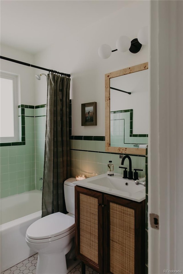 4422 W 27th Ave, Denver, CO 80212 - full bathroom with tile walls, toilet, vanity, shower / bath combo with shower curtain, and tile patterned floors