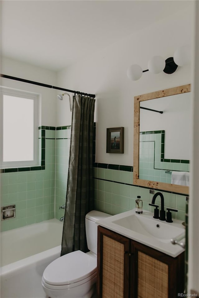 4422 W 27th Ave, Denver, CO 80212 - full bath featuring tile walls, toilet, shower / bathtub combination with curtain, vanity, and a wainscoted wall