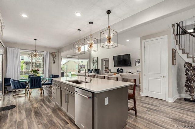 5964 E 141st Ave, Thornton, CO 80602 - kitchen with a sink, dishwasher, dark wood finished floors, light countertops, and recessed lighting