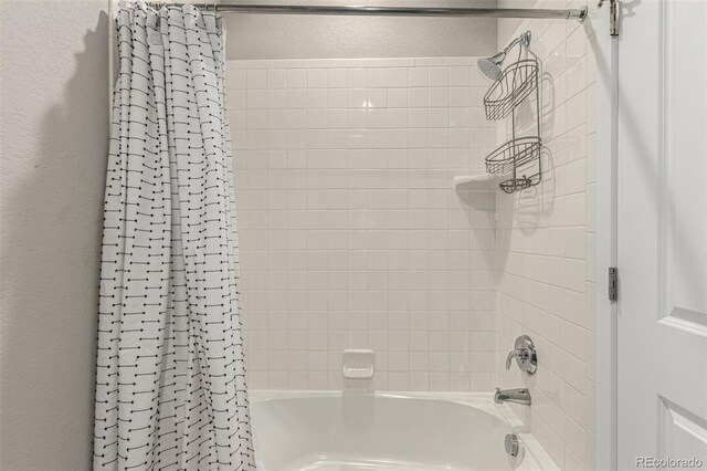 5964 E 141st Ave, Thornton, CO 80602 - full bath with shower / tub combo with curtain and a textured wall