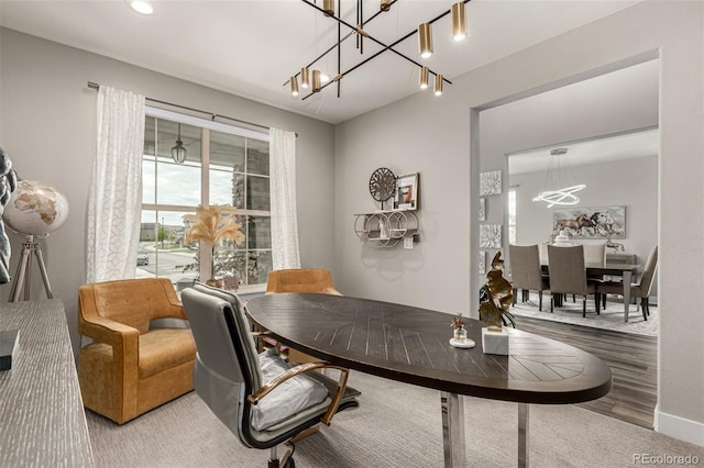 5964 E 141st Ave, Thornton, CO 80602 - home office with a chandelier and wood finished floors