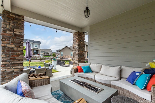5964 E 141st Ave, Thornton, CO 80602 - view of patio / terrace with an outdoor living space with a fire pit and a residential view