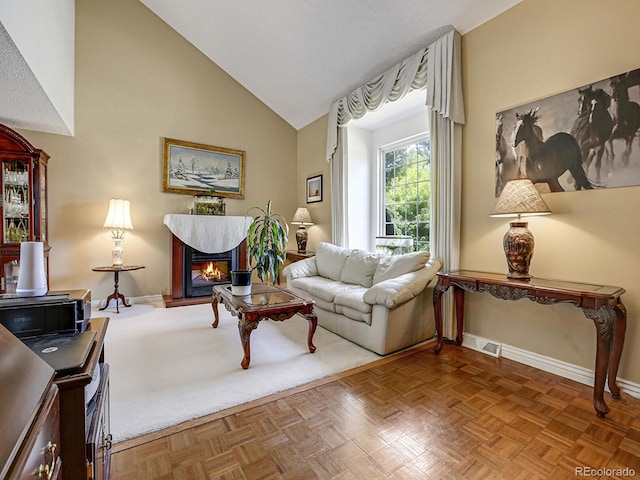 living room featuring parquet floors and vaulted ceiling