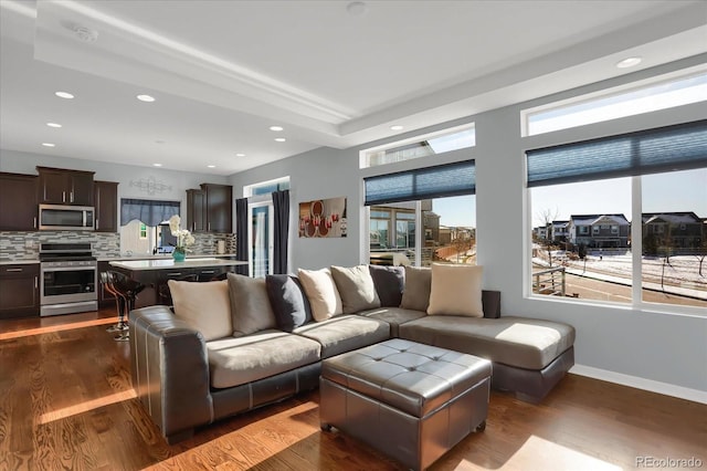 17938 E 54th Ave, Denver, CO 80249 - living area with baseboards, recessed lighting, and dark wood-style floors