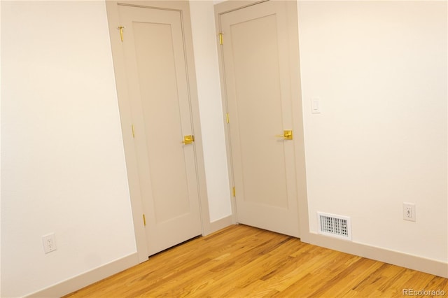 unfurnished room featuring light hardwood / wood-style flooring