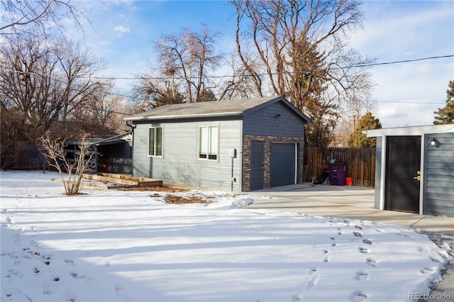 view of snow covered garage