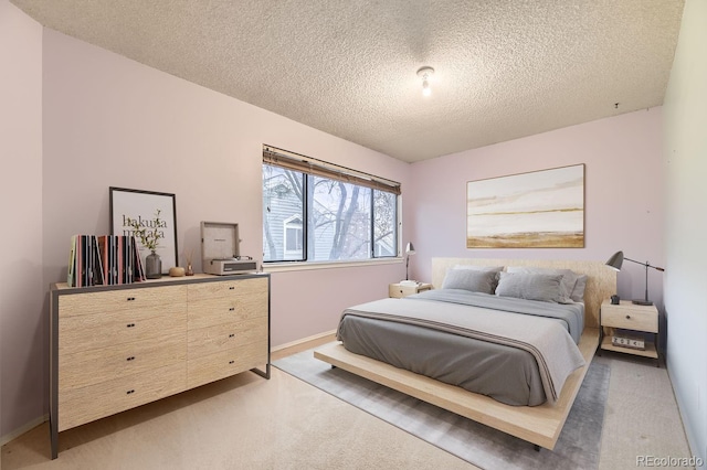 carpeted bedroom with a textured ceiling