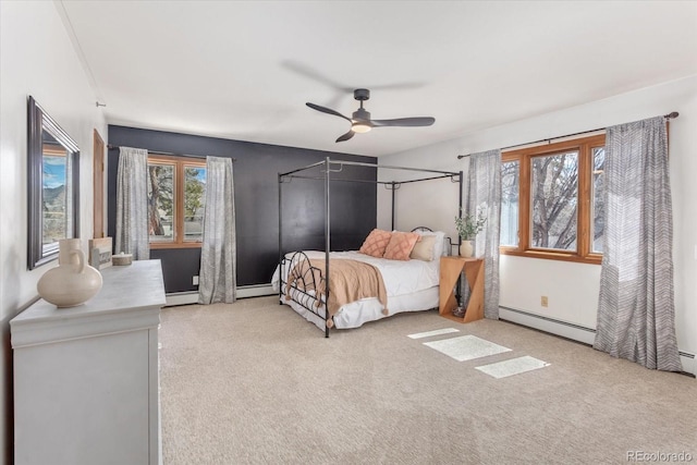 bedroom featuring carpet flooring, a ceiling fan, and a baseboard radiator