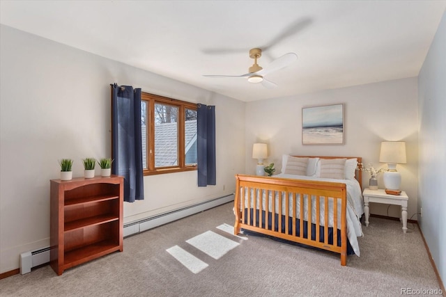 carpeted bedroom featuring a baseboard radiator, baseboards, and a ceiling fan