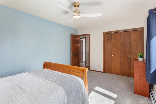 carpeted bedroom featuring a closet, baseboards, and ceiling fan