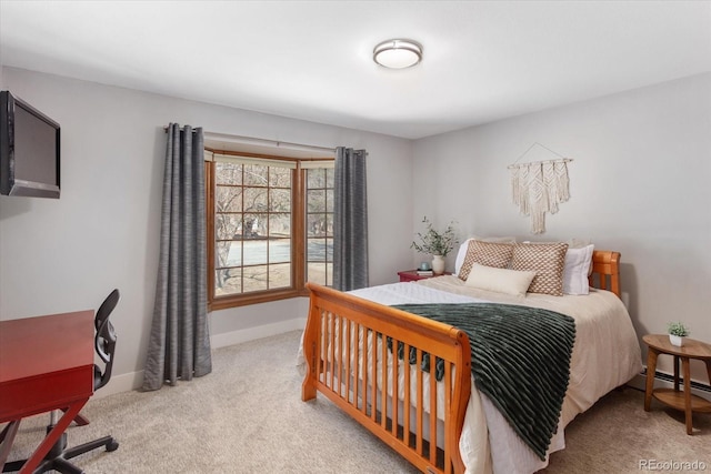 bedroom with carpet flooring and baseboards