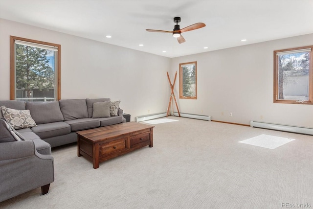 living room with recessed lighting, a healthy amount of sunlight, and light carpet