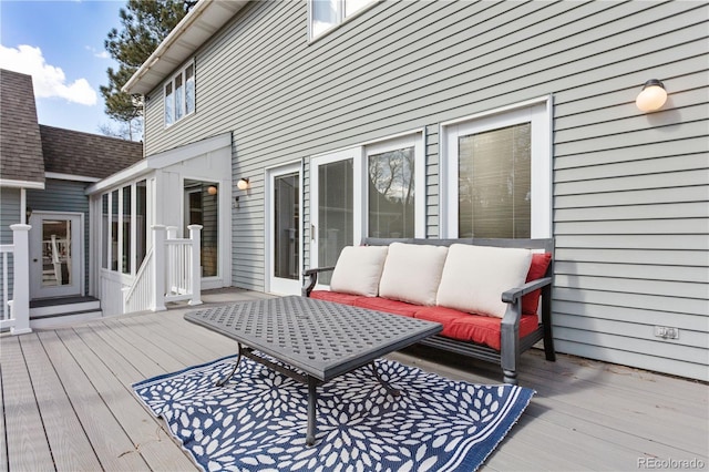 wooden deck featuring an outdoor hangout area