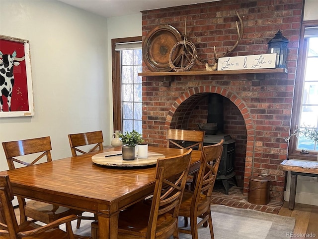 419 Princeton Ave, Buena Vista, CO 81211 - dining space with a wood stove, plenty of natural light, and wood finished floors