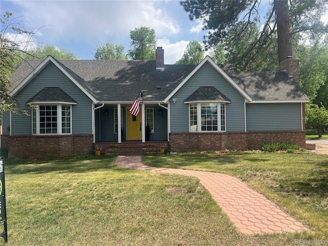 419 Princeton Ave, Buena Vista, CO 81211 - single story home with brick siding, a chimney, a front yard, and a porch