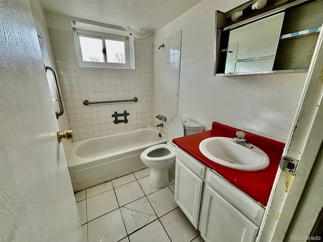 full bathroom with tile patterned flooring, tiled shower / bath combo, toilet, and vanity