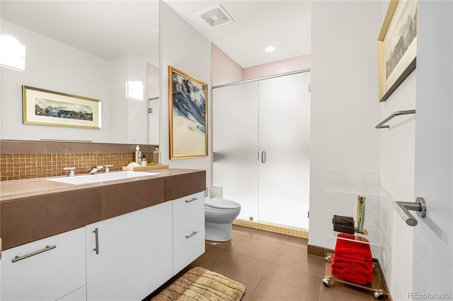 1250 Dolan Dr, Monument, CO 80132 - bathroom featuring vanity, a shower stall, tile patterned flooring, and backsplash
