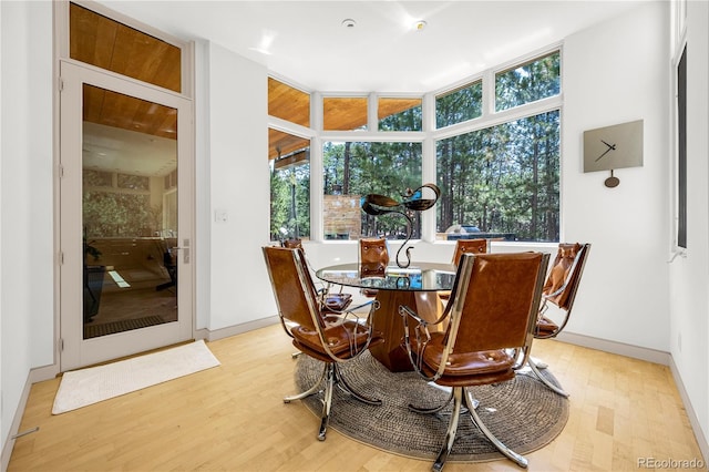 1250 Dolan Dr, Monument, CO 80132 - dining space with baseboards and light wood finished floors