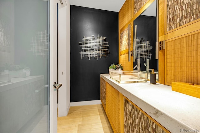 1250 Dolan Dr, Monument, CO 80132 - bathroom with wood finished floors and vanity