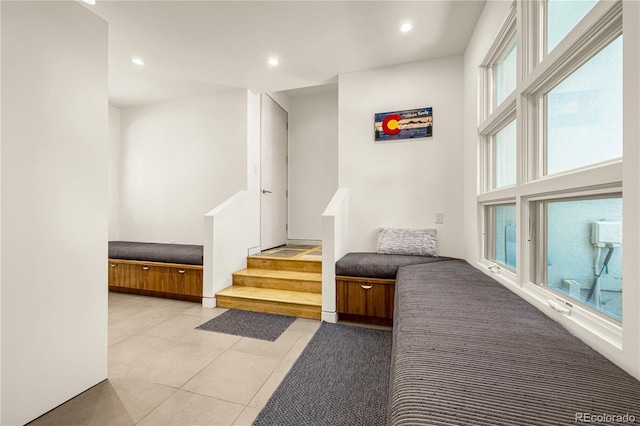 1250 Dolan Dr, Monument, CO 80132 - corridor featuring light tile patterned flooring, recessed lighting, and stairway