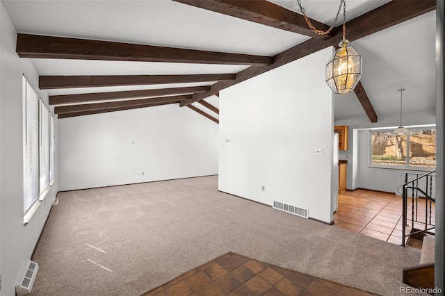 unfurnished living room featuring vaulted ceiling with beams, visible vents, a chandelier, and light colored carpet