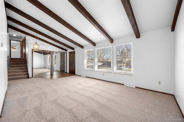 interior space with baseboards, visible vents, stairway, vaulted ceiling with beams, and carpet floors