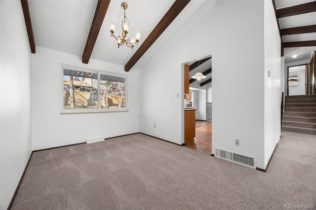 interior space featuring carpet, visible vents, a chandelier, beamed ceiling, and stairs