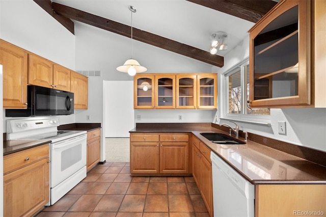 kitchen with white appliances, visible vents, dark countertops, glass insert cabinets, and a sink