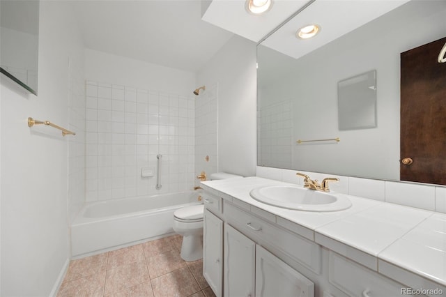 bathroom with shower / tub combination, vanity, toilet, and tile patterned floors