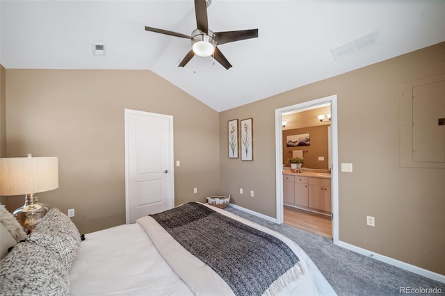 8626 Gold Peak Dr Unit B, Highlands Ranch, CO 80130 - bedroom with lofted ceiling, light carpet, connected bathroom, electric panel, and a ceiling fan