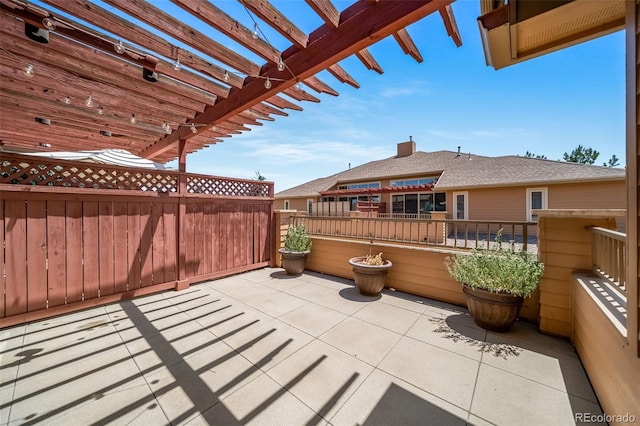 8626 Gold Peak Dr Unit B, Highlands Ranch, CO 80130 - view of patio featuring a pergola
