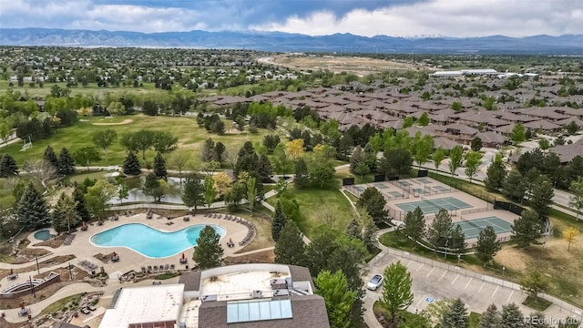 8626 Gold Peak Dr Unit B, Highlands Ranch, CO 80130 - bird's eye view of mountains and a pool