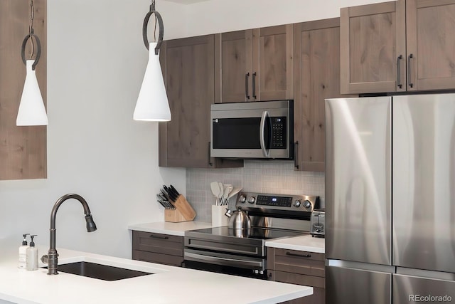 361 Gcr 840 Unit 3, Fraser, CO 80442 - kitchen with stainless steel appliances, tasteful backsplash, and light countertops